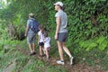 Family hiking the Cross Island Track in the rain forest of a tropical pacific island Royalty Free Stock Photo