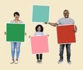 Family holding colorful square boards