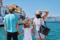 Family holding hands, back view, sea mediterranean vacation Royalty Free Stock Photo