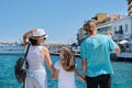 Family holding hands, back view, sea mediterranean vacation Royalty Free Stock Photo