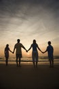 Family Holding Hands on Beach Royalty Free Stock Photo