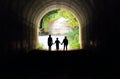 Family holding hands in the tunnel
