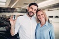 Family holding keys of new car Royalty Free Stock Photo