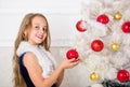 Family holiday concept. Girl velvet dress feel festive near christmas tree. Spread christmas cheer. Kid happy because Royalty Free Stock Photo
