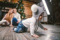 Family holiday New Year and Christmas. Young caucasian family mom dad son 1 year sit wooden floor near fireplace christmas tree on Royalty Free Stock Photo