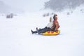 Family holidays in the mountains, sledding, skiing , snowboarding and other winter activities in the bosom of nature. Royalty Free Stock Photo