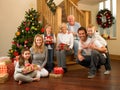 Family at home around christmas tree Royalty Free Stock Photo