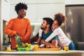 Family at home eating breakfast in kitchen together Royalty Free Stock Photo