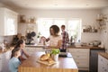 Family At Home Eating Breakfast In Kitchen Together Royalty Free Stock Photo