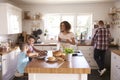 Family At Home Eating Breakfast In Kitchen Together Royalty Free Stock Photo