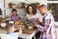 Family At Home Eating Outdoor Meal Together