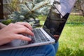 Teenager girl studying on a laptop. Distance education. Happy schoolgirl in Park with computer Royalty Free Stock Photo