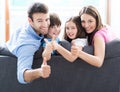 Family at home with thumbs up Royalty Free Stock Photo