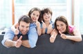 Family at home with thumbs up Royalty Free Stock Photo