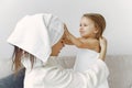 Mother with daughter in bathrobe and towels Royalty Free Stock Photo