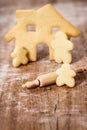 Family and house cookies on wooden table, concept planning and baking a homestead