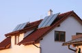 Family house with solar panels on the roof for water heating Royalty Free Stock Photo