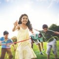 Family Hula Hooping Relaxing Outdoors Concept