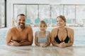 Family in the indoor swimming pool Royalty Free Stock Photo