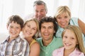 Family indoors together smiling