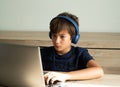 Family issue, Teen boy wearing headset have bad habit problem addicted to online game on Computer. Teenage boy playing online game