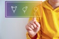 Family issues Gender confusion in teenager.  A teen boy pointing at gender symbols of male bigender and transgender. Concept of c Royalty Free Stock Photo