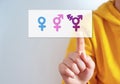 Family issues Gender confusion in teenager.  A teen boy pointing at gender symbols of male bigender and transgender. Concept of c Royalty Free Stock Photo