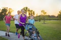 Family jogging and exercising outdoors together Royalty Free Stock Photo