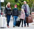 Family journey: spouses with children walking and luggage Royalty Free Stock Photo