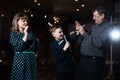 Family karaoke. Portrait of a happy family, singing in microphones Royalty Free Stock Photo