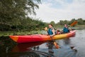 Family in a kayak on a water walk