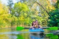 Family kayaking, mother and child paddling in kayak on river canoe tour, active autumn weekend and vacation, sport and fitness Royalty Free Stock Photo