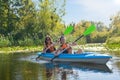Family kayaking, mother and child paddling in kayak on river canoe tour, active autumn weekend and vacation, sport and fitness Royalty Free Stock Photo