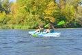 Family kayaking, mother and child paddling in kayak on river canoe tour, active summer weekend and vacation Royalty Free Stock Photo