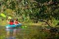 Family kayaking, mother and child paddling in kayak on river canoe tour, active summer weekend and vacation, sport and fitness Royalty Free Stock Photo