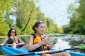 Family kayaking, mother and child paddling in kayak on river canoe tour having fun, active weekend and vacation, fitness co Royalty Free Stock Photo