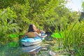 Family kayaking, mother and daughter paddling in kayak on river canoe tour having fun, active autumn weekend with children Royalty Free Stock Photo