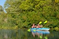 Family kayaking, mother and daughter paddling in kayak on river canoe tour having fun, active autumn weekend with children Royalty Free Stock Photo