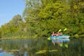 Family kayaking, mother and daughter paddling in kayak on river canoe tour having fun, active autumn weekend Royalty Free Stock Photo