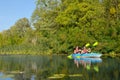 Family kayaking, mother and daughter paddling in kayak on river canoe tour having fun, active autumn weekend Royalty Free Stock Photo