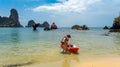 Family kayaking, mother and daughter paddling in kayak on tropical sea canoe tour near islands, having fun, active vacation Royalty Free Stock Photo