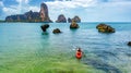 Family kayaking, mother and daughter paddling in kayak on tropical sea canoe tour near islands, having fun, active vacation Royalty Free Stock Photo