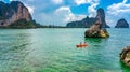 Family kayaking, mother and daughter paddling in kayak on tropical sea canoe tour near islands, having fun, active vacation Royalty Free Stock Photo