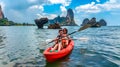 Family kayaking, mother and daughter paddling in kayak on tropical sea canoe tour near islands, having fun, Thailand, Krabi Royalty Free Stock Photo