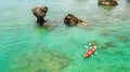 Family kayaking, mother and daughter paddling in kayak on tropical sea canoe tour near islands, having fun, active vacation Royalty Free Stock Photo