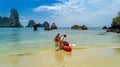 Family kayaking, mother and daughter paddling in kayak on tropical sea canoe tour near islands, having fun, active vacation Royalty Free Stock Photo