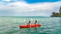 Family kayaking, mother and daughter paddling in kayak on tropical sea canoe tour near islands, having fun, Thailand, Krabi