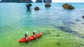 Family kayaking, mother and daughter paddling in kayak on tropical sea canoe tour near islands, having fun, Thailand, Krabi Royalty Free Stock Photo