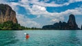 Family kayaking in sea, mother and daughter paddling in kayak on tropical sea canoe tour near islands in Thailand Royalty Free Stock Photo