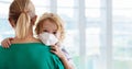 Mother and child with face mask and hand sanitizer Royalty Free Stock Photo
